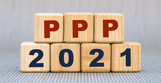 three wooden blocks with letters PPP stacked on top four wooden blocks with numbers 2021.