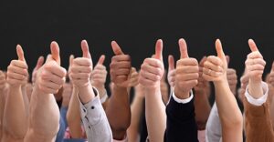 large group of hands in thumbs up sign