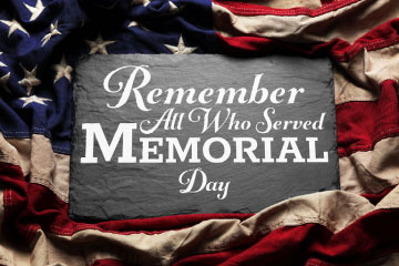 Remember all who served Memorial Day written on slate surrounded by American flag