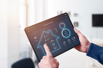 All in one smart home energy-efficient control system app concept on tablet display in man hands
