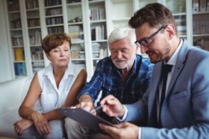 Senior couple estate planning with younger family member