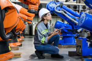 Maintenance engineer worker working with AI robotic machine automation
