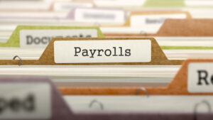 Payroll - Folder Register Name in Directory. Colored, Blurred Image. Closeup View. 