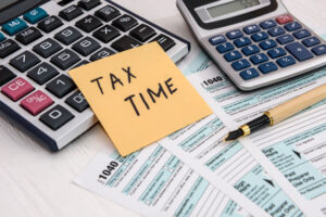 'Tax time' memo on 1040 individual tax form remind that it is time to file your taxes