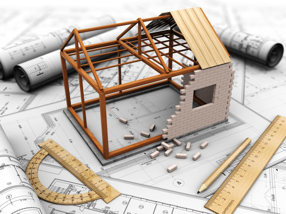 A miniature house sits on top of blueprints. This could represent the planning stage of a construction project, where budgeting is crucial. The blueprint lays out the design of the house, while the house model helps to visualize the final product. Both the blueprint and the house model are essential for creating a budget for the construction project. By carefully considering all of the costs involved in building the house, contractors can avoid going over budget