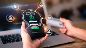 Mobile online banking concept. Close-up of hands using mobile phone and holding credit card that is blurred in the background